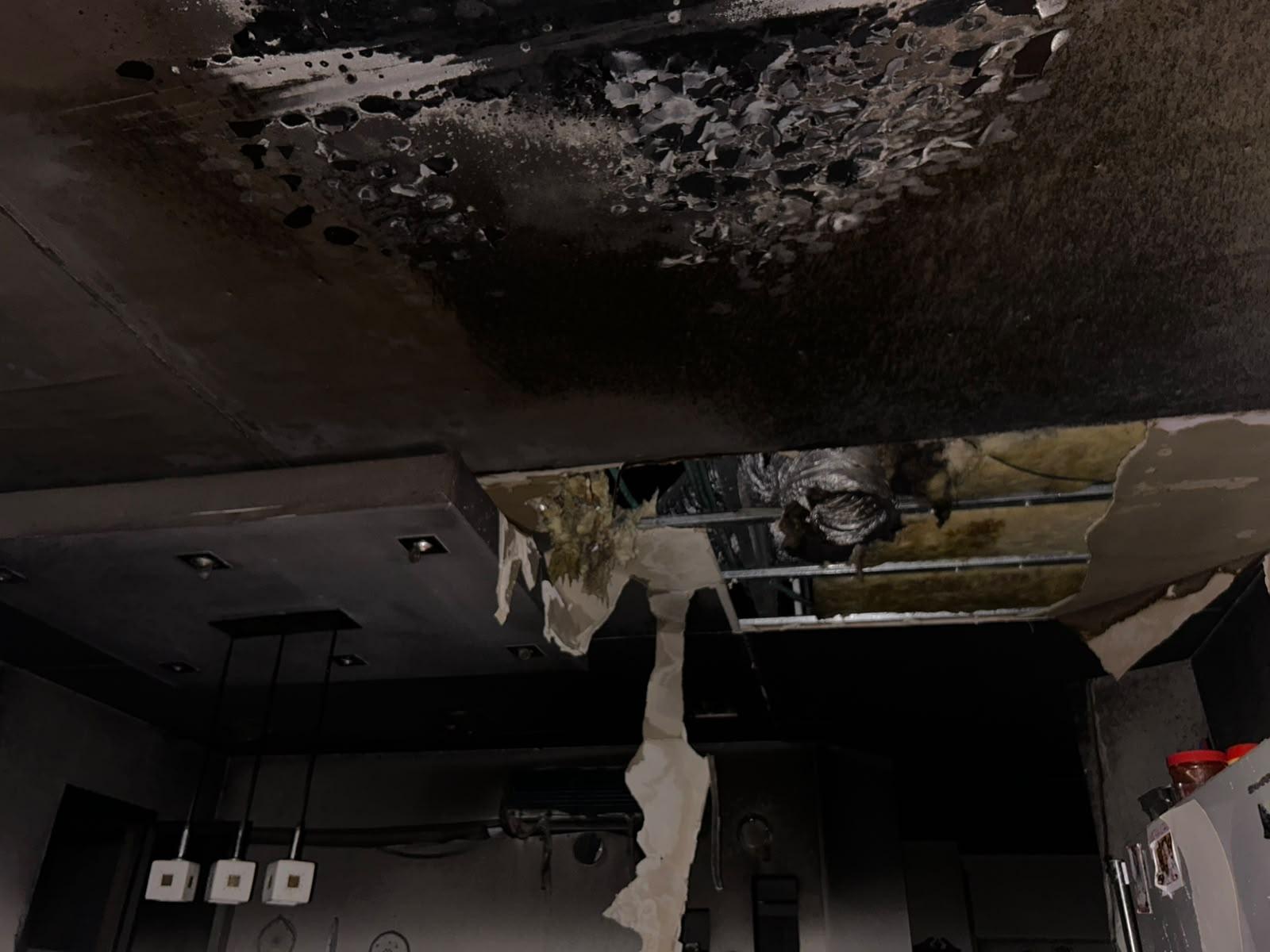 The ceiling collapsed, exposing the steel frame and insulation